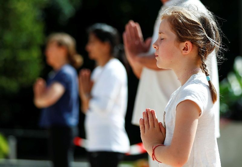 Participants perform yoga during a live broadcast marking World Yoga Day in Brussels, Belgium . (Photo by Francois Lenoir/Reuters)